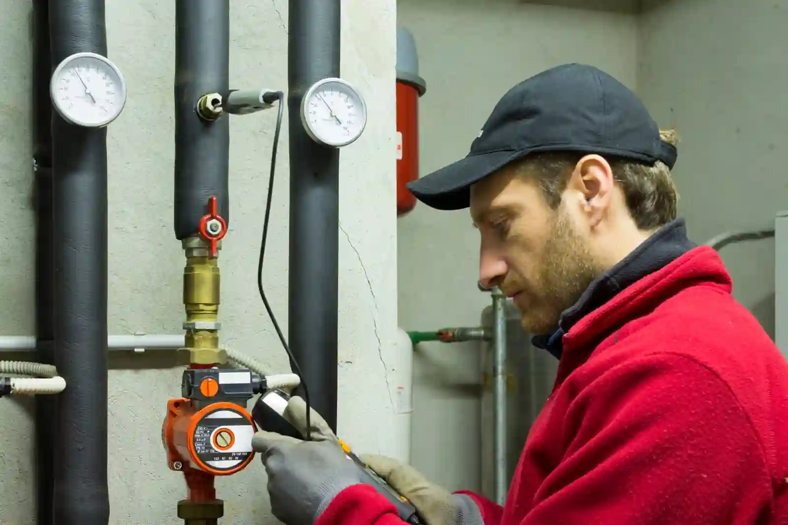plumber working on heat system plumber working on heat system