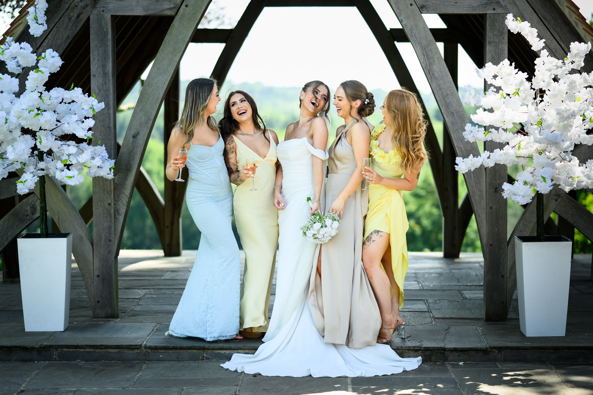 Bride and friends sharing a joke at Highley Manor. Captured by relaxed Sussex wedding photographer Paul Streeter_Staniford