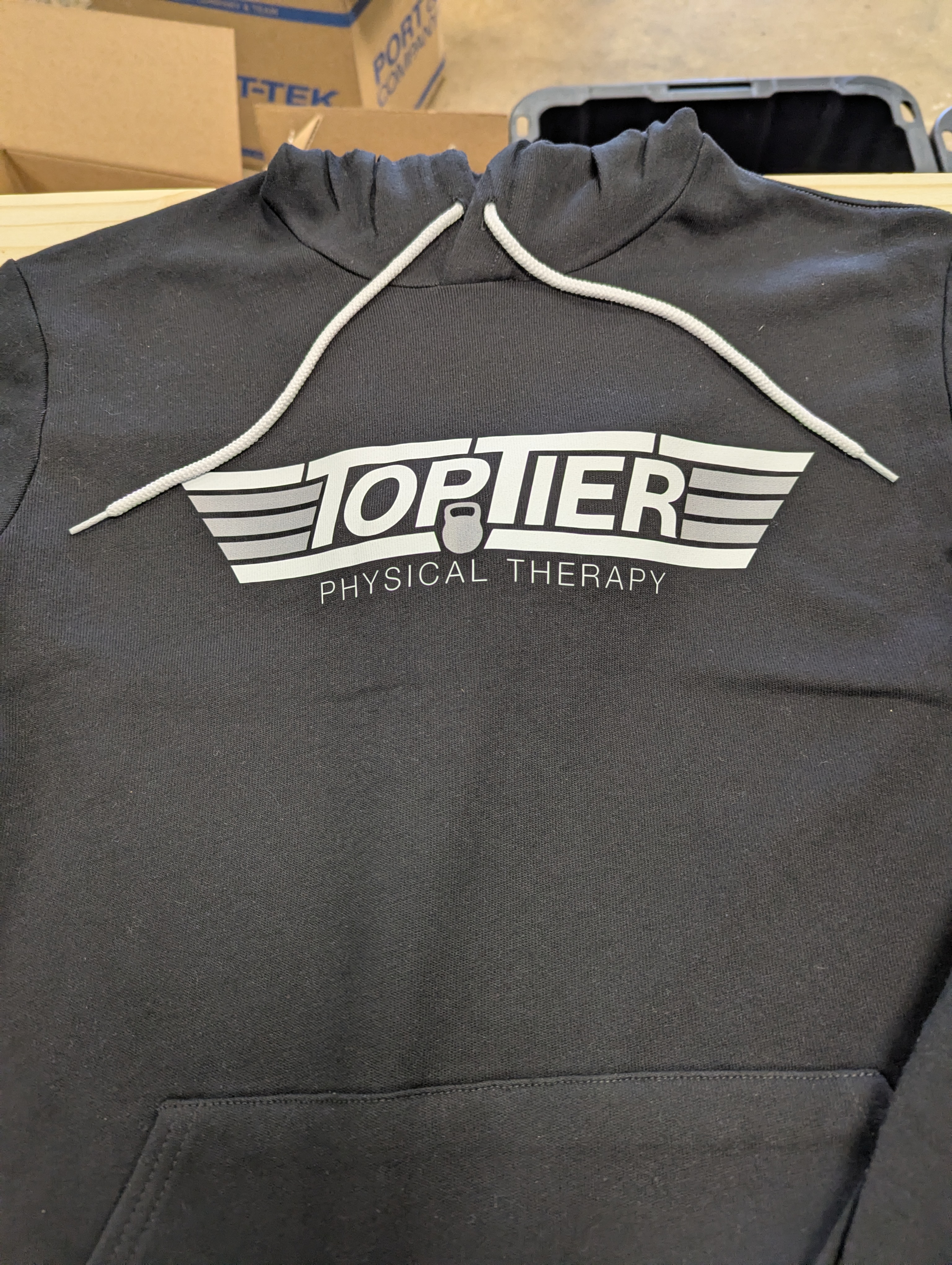 custom hooded sweatshirt with a dtf print on it saying top tier